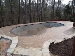 Aslar stamped patio with mesa tan coping