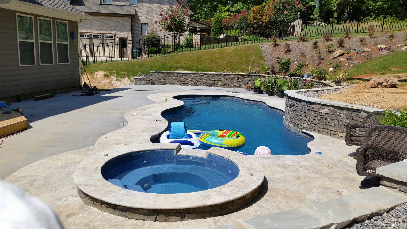 Travertine and broomed pool patio